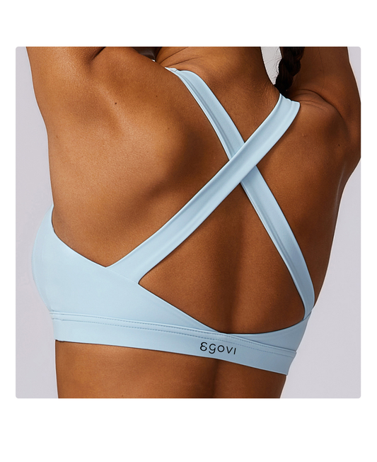 supportive cross-back sports bra with removable padding. Made from 78% polyamide and 22% elastane for comfort, flexibility, and breathability. Perfect for gym, yoga, or daily activewear.