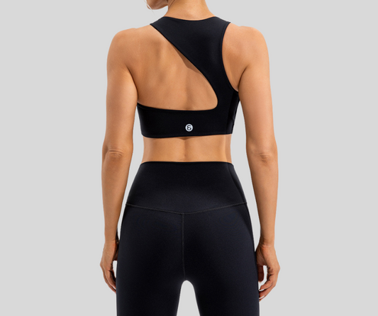 Make a bold statement with this asymmetrical one-shoulder sports bra featuring a dynamic cutout back design. Crafted from smooth, stretchy fabric that hugs the body, it provides medium support and a stylish edge for your active wardrobe.