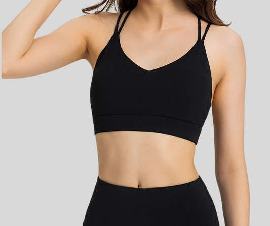 Flaunting a flattering V-neckline and intricate crisscross back straps, this sports bra blends elegance with performance. Designed with a soft, supportive band and breathable stretch fabric, it provides light to medium support while keeping you stylish.