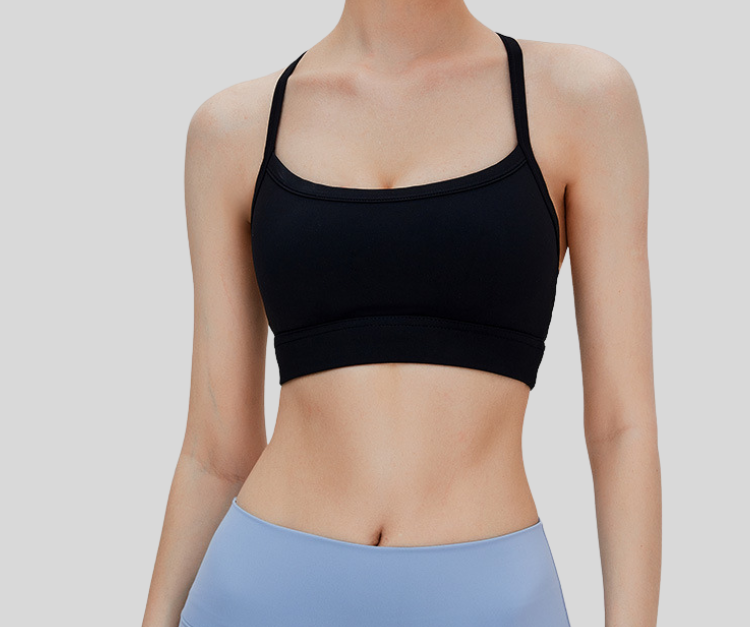 Sleek and supportive, this black bra top features a stylish T-back design with slim shoulder straps for enhanced comfort and freedom of movement. Made from breathable, stretchable fabric with a snug under-bust band, it's ideal for medium-impact activities like weight training, pilates, spinning, and barre.