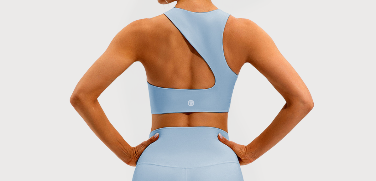 Make a bold statement with this asymmetrical one-shoulder sports bra featuring a dynamic cutout back design. Crafted from smooth, stretchy fabric that hugs the body, it provides medium support and a stylish edge for your active wardrobe.