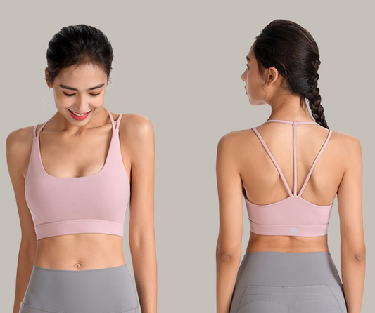 Sleek and supportive, this sports bra features a stylish strappy back design and smooth, sweat-wicking fabric—perfect for yoga, pilates, and low- to medium-impact workouts.