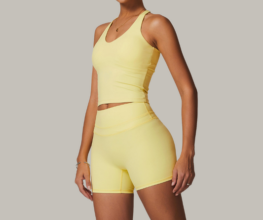 This sleek longline tank features a flattering scoop neckline and adjustable strappy back for a custom fit. Crafted from smooth, stretch fabric for comfort and support—perfect for yoga, Pilates, barre, and light training sessions