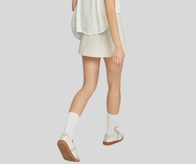 This vibrant pleated skirt combines sporty function with flirty style. Featuring built-in shorts for coverage and stretch comfort, it’s perfect for Picker Ball, tennis, golf, dance, and casual active days.