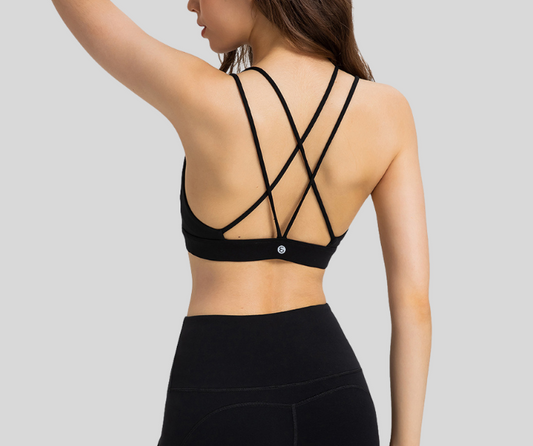 Flaunting a flattering V-neckline and intricate crisscross back straps, this sports bra blends elegance with performance. Designed with a soft, supportive band and breathable stretch fabric, it provides light to medium support while keeping you stylish.