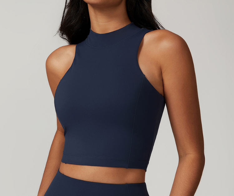 This sleek, high-neck crop tank delivers a streamlined fit with full back coverage and breathable stretch fabric. Perfect for high and low-impact workouts including strength training, yoga, cycling, and gym sessions