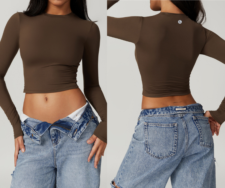 This sleek, fitted long sleeve crop top features buttery-soft, stretch fabric with thumbholes for extra support. Perfect for strength training, light cardio, yoga, and layering before or after workouts