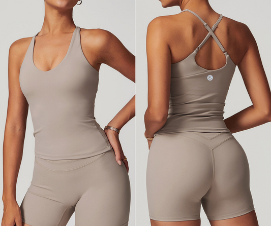 This sleek longline tank features a flattering scoop neckline and adjustable strappy back for a custom fit. Crafted from smooth, stretch fabric for comfort and support—perfect for yoga, Pilates, barre, and light training sessions