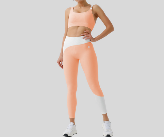 Stand out in this vibrant ribbed set, featuring a double-strap sports bra and matching high-waisted leggings with bold color block details. The top offers light to medium support with a stylish open-back design, while the leggings sculpt and move with you in all the right places.

Fitness Suitability:
Perfect for Strength Training, yoga, Pilates, walking, and light to moderate workouts—ideal for staying supported while looking effortlessly bold.