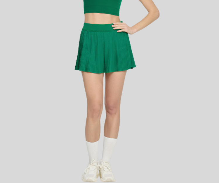 This vibrant pleated skirt combines sporty function with flirty style. Featuring built-in shorts for coverage and stretch comfort, it’s perfect for Picker Ball, tennis, golf, dance, and casual active days.