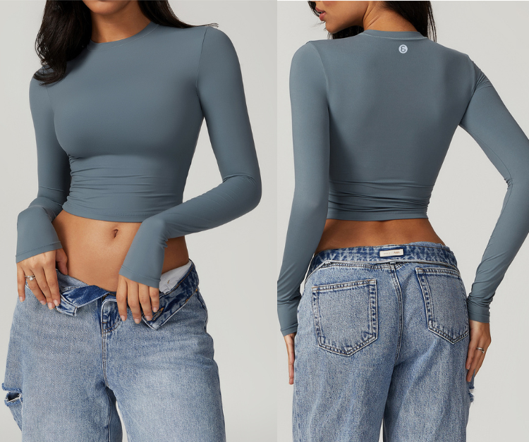 This sleek, fitted long sleeve crop top features buttery-soft, stretch fabric with thumbholes for extra support. Perfect for strength training, light cardio, yoga, and layering before or after workouts