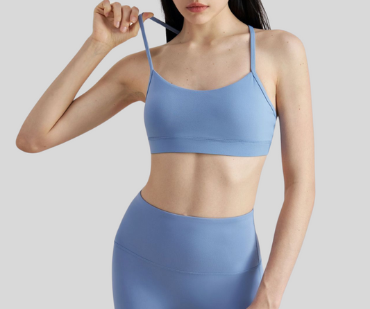 This sleek, sports bra features a minimalist scoop neckline and slim racerback straps for unrestricted movement. Made with breathable, stretch fabric for a barely-there feel and light to medium support.

Fitness Suitability:
Ideal for yoga, Pilates, barre, light gym sessions, or layering under activewear for all-day comfort.