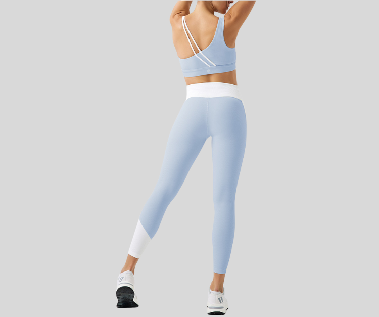 Stand out in this vibrant ribbed set, featuring a double-strap sports bra and matching high-waisted leggings with bold color block details. The top offers light to medium support with a stylish open-back design, while the leggings sculpt and move with you in all the right places.

Fitness Suitability:
Perfect for Strength Training, yoga, Pilates, walking, and light to moderate workouts—ideal for staying supported while looking effortlessly bold.