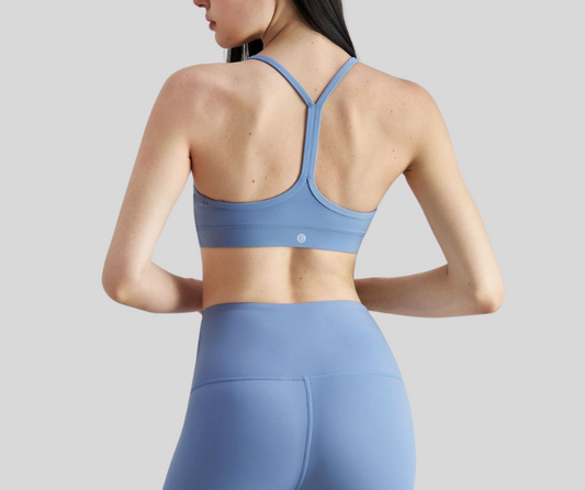 This sleek, sports bra features a minimalist scoop neckline and slim racerback straps for unrestricted movement. Made with breathable, stretch fabric for a barely-there feel and light to medium support.

Fitness Suitability:
Ideal for yoga, Pilates, barre, light gym sessions, or layering under activewear for all-day comfort.