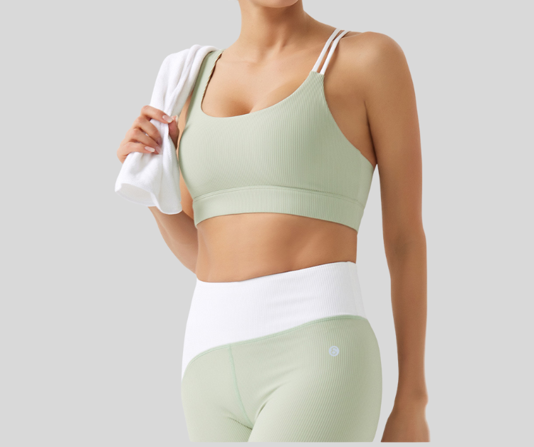 Stand out in this vibrant ribbed set, featuring a double-strap sports bra and matching high-waisted leggings with bold color block details. The top offers light to medium support with a stylish open-back design, while the leggings sculpt and move with you in all the right places.

Fitness Suitability:
Perfect for Strength Training, yoga, Pilates, walking, and light to moderate workouts—ideal for staying supported while looking effortlessly bold.