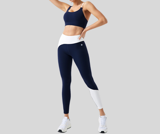 Stand out in this vibrant ribbed set, featuring a double-strap sports bra and matching high-waisted leggings with bold color block details. The top offers light to medium support with a stylish open-back design, while the leggings sculpt and move with you in all the right places.

Fitness Suitability:
Perfect for Strength Training, yoga, Pilates, walking, and light to moderate workouts—ideal for staying supported while looking effortlessly bold.