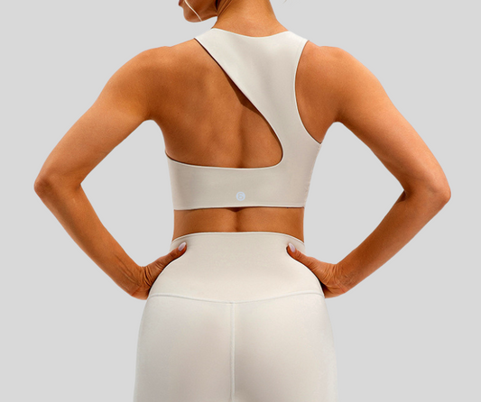 Make a bold statement with this asymmetrical one-shoulder sports bra featuring a dynamic cutout back design. Crafted from smooth, stretchy fabric that hugs the body, it provides medium support and a stylish edge for your active wardrobe.