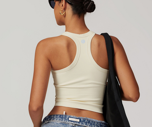 A sporty essential with a sleek fit, this ribbed racerback tank features stretch fabric and a breathable design—ideal for light fitness activities like yoga, Pilates, or active errands in style