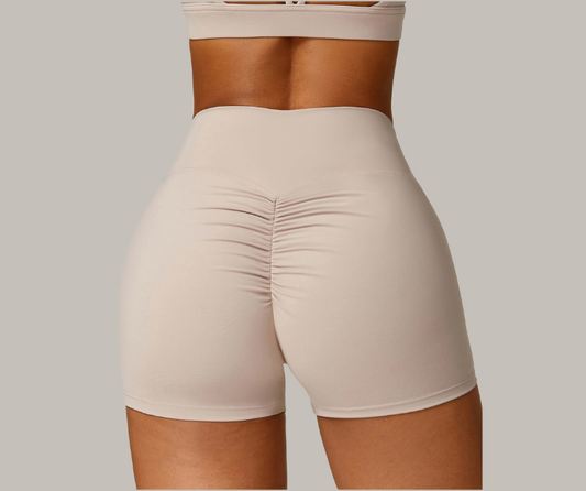 Flatter your curves with these high-waisted, scrunch-back shorts. Made from soft, sweat-wicking stretch fabric—perfect for gym, yoga, or all-day wear.