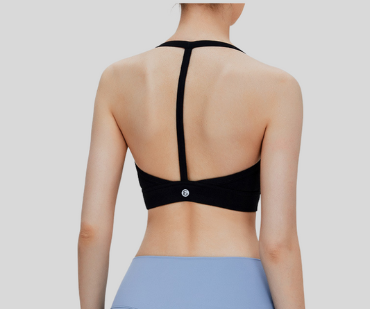 Sleek and supportive, this black bra top features a stylish T-back design with slim shoulder straps for enhanced comfort and freedom of movement. Made from breathable, stretchable fabric with a snug under-bust band, it's ideal for medium-impact activities like weight training, pilates, spinning, and barre.