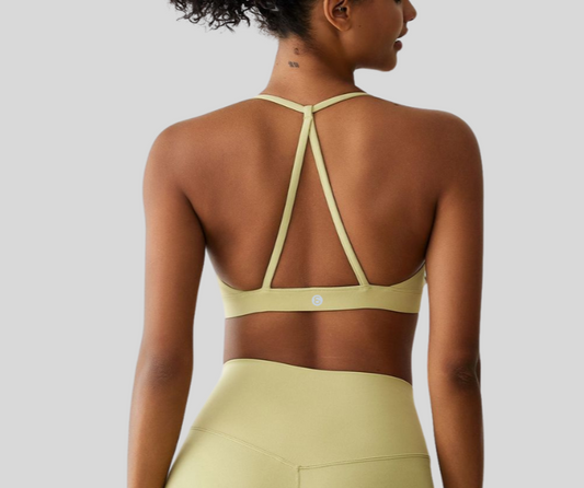This vibrant sports bra features a flattering scoop neckline and stylish strappy back design for light to medium support. Crafted from soft, stretch fabric that moves with you while keeping you cool and comfortable.

Fitness Suitability:
Ideal for yoga, Pilates, barre, walking, and everyday active wear—perfect for low to moderate impact workouts with a bold, confident look.